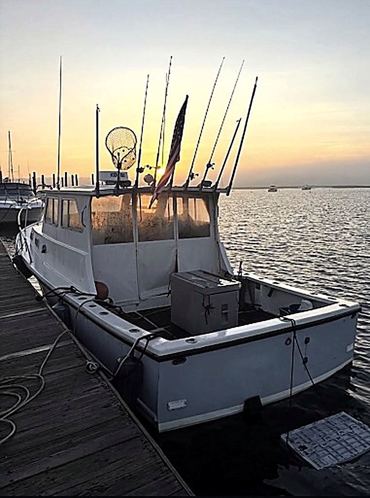 Chief, the 31-foot custom Downeast, docked at sunset in Mount Sinai Harbor