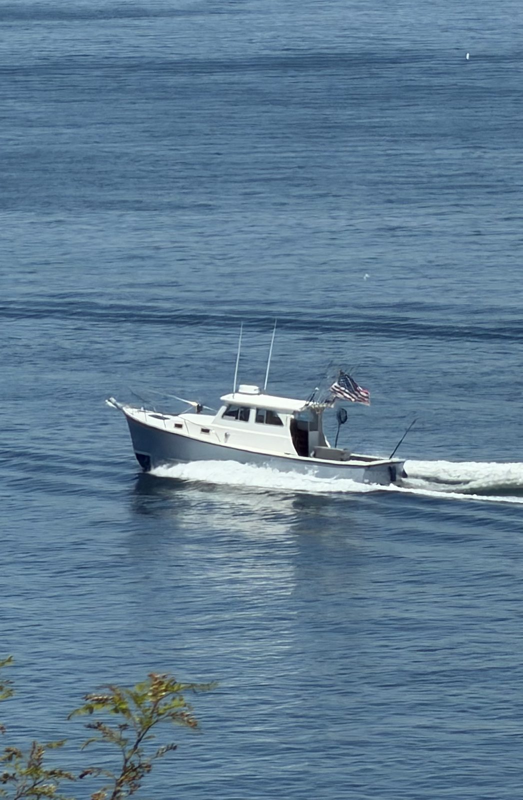 Chief, the 31ft custom Downeast, underway on Long Island Sound with the American flag flying